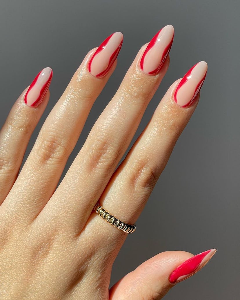 Red hourglass nail art is perfect for Leo season 2024.