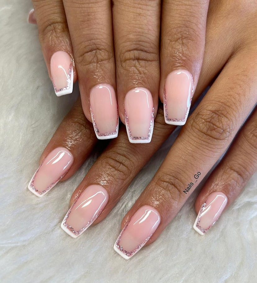 Try square-shaped French tip nails that are lined with glitter polish.