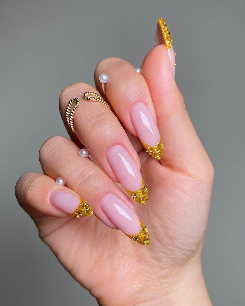 Gilded French tip nails are perfect for Leo season 2024.