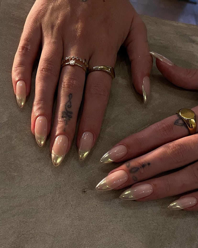 Gold chrome French tip nails are perfect for Leo season 2024.