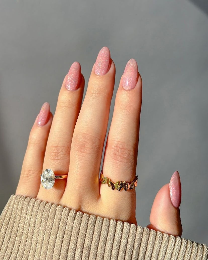 Neutral shimmering nail polish is perfect for Leo season 2024.