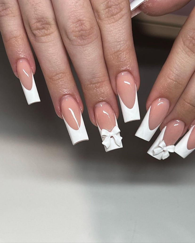 Try classic French tip nails with 3D ribbon decals.