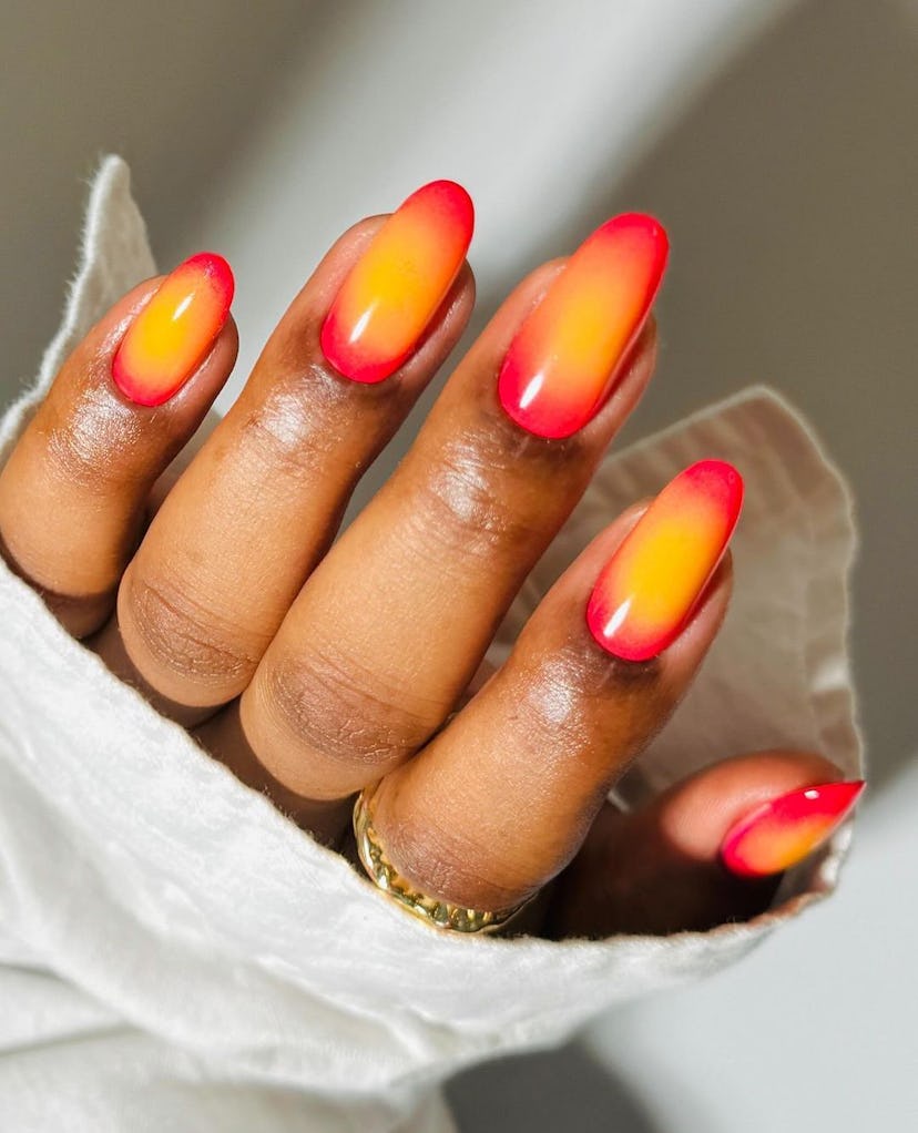 Try sunset aura nails for summer 2024.