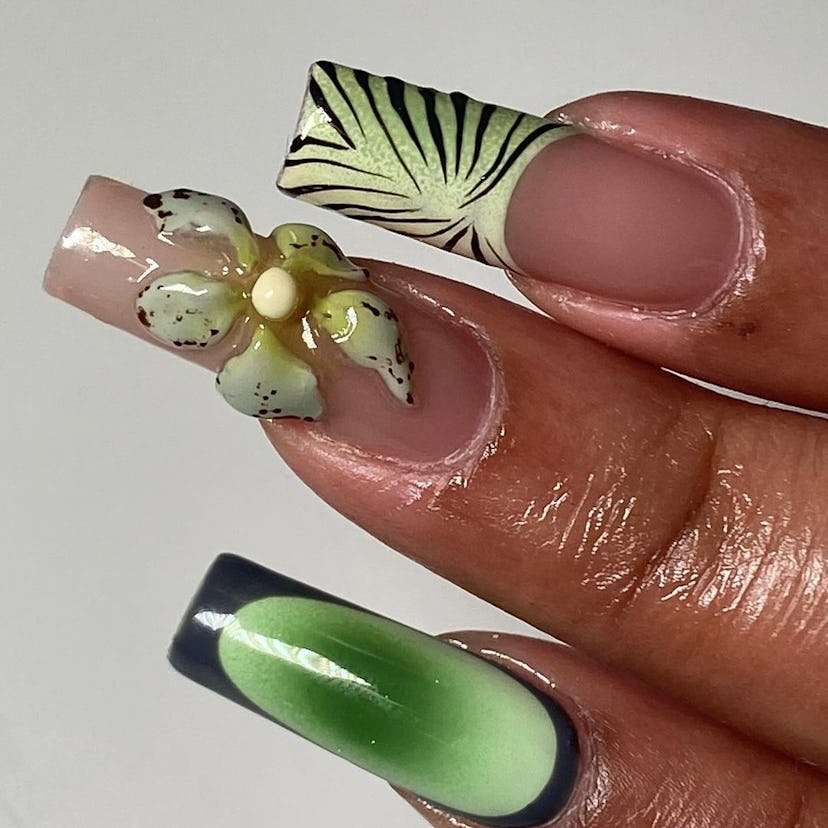 Green tropical orchid nail art gives 