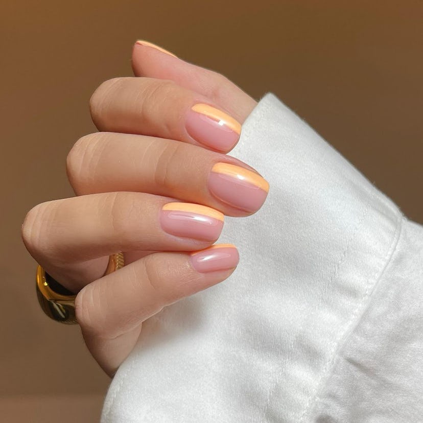 Try peach-colored vertical lines on your nails for summer 2024.