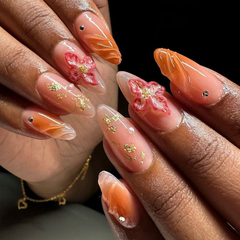 3D orange orchid flower nail art is perfect for Leo season 2024.