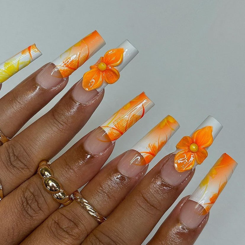 Try 3D peach blossom nail art for summer 2024.