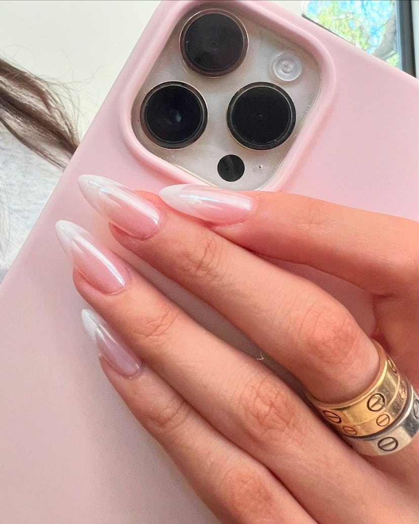 Madison Beer just got classic French tip nails with a chrome finish.