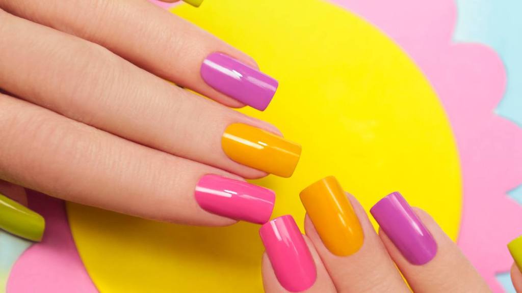 Solar manicure colored varnishes rectangular shaped nails.