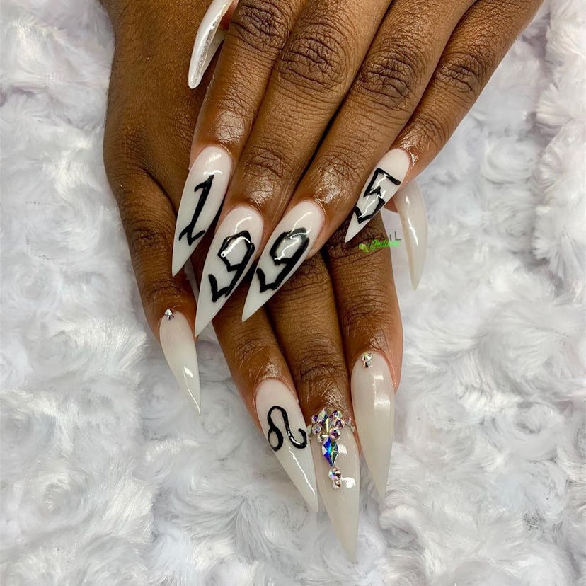 Leo symbol and birth year nail art is perfect for Leo season 2024.