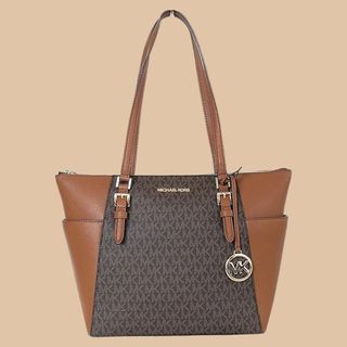 Flat lay brown bag Michael Kors