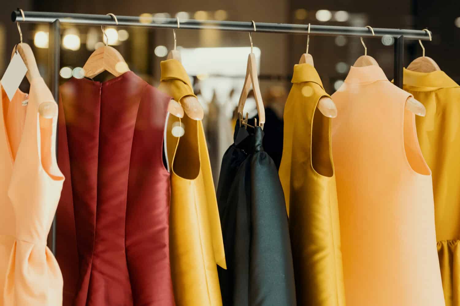 shopping concept - colorful clothing in a fancy store