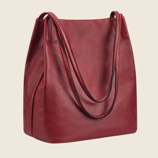 flat lay of red leather large handbag 