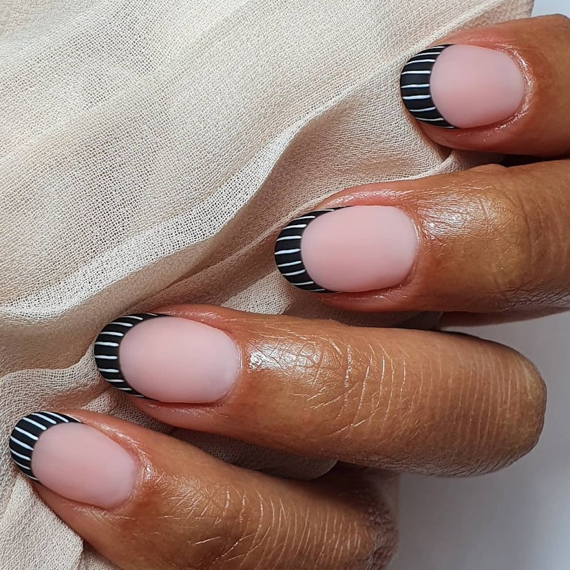 Black and white nail art designs are on-trend for fall 2024.