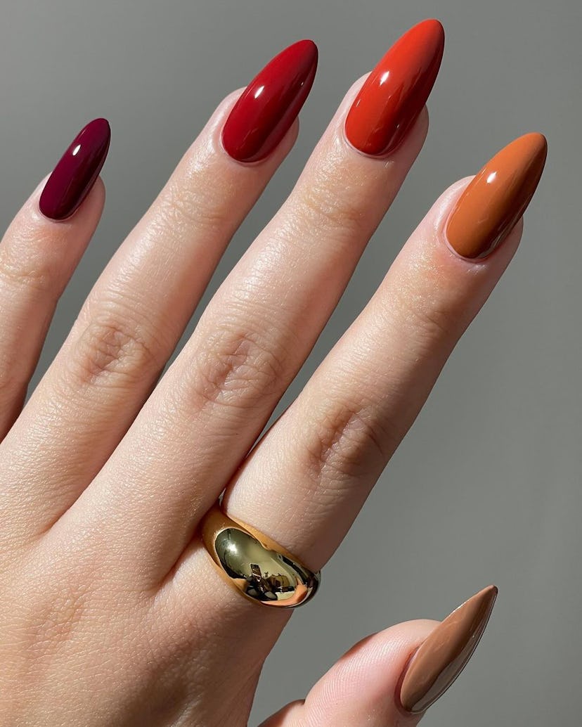 Fall-inspired Skittle nail art designs are on-trend for fall 2024.