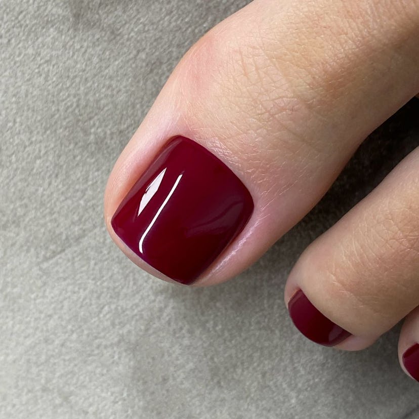 Burgundy pedicures are on-trend for fall 2024.