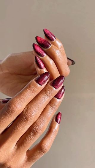 Long red cat eye nails