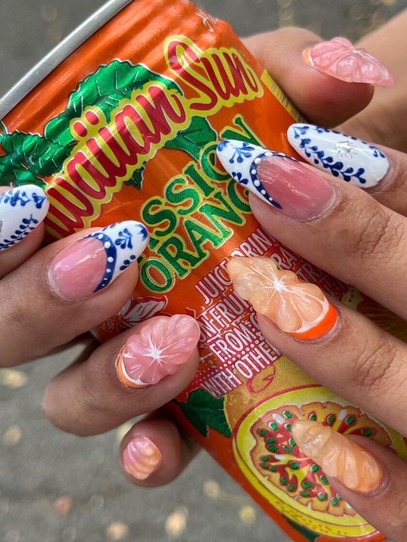 Orange and Greek patterns nail art by Madison Seto