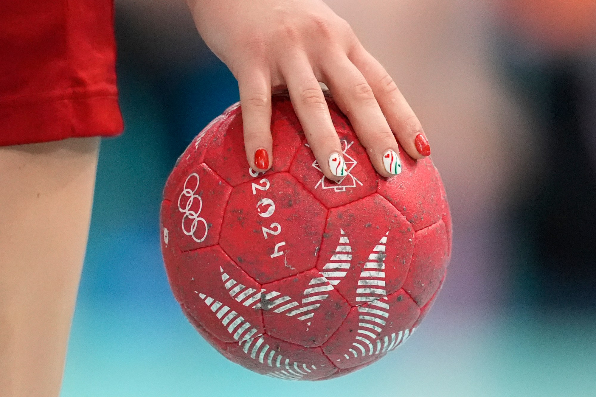 Tovizi Petra Anita Fuezi, of Hungary, holds the ball during a women's handball match against Netherlands at the 2024 Summer Olympics, Saturday, Aug. 3, 2024, in Paris, France. (AP Photo/Aaron Favila)