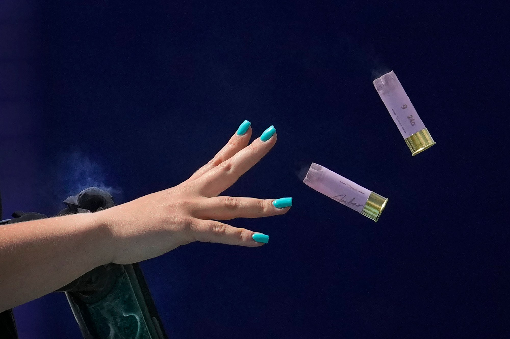 Britain's Amber Jo Rutter ejects empty cartridges from her gun as she competes in the Skeet women's final at the 2024 Summer Olympics, Sunday, Aug. 4, 2024, in Chateauroux, France. (AP Photo/Manish Swarup)