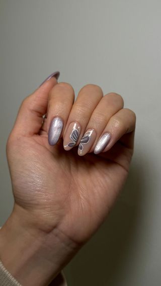 Lilac cat eye nails with butterfly nail art