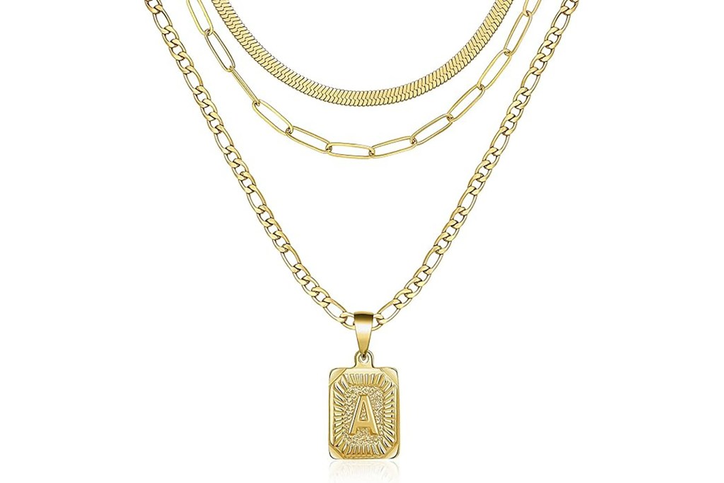 A gold chain necklace with a pendant