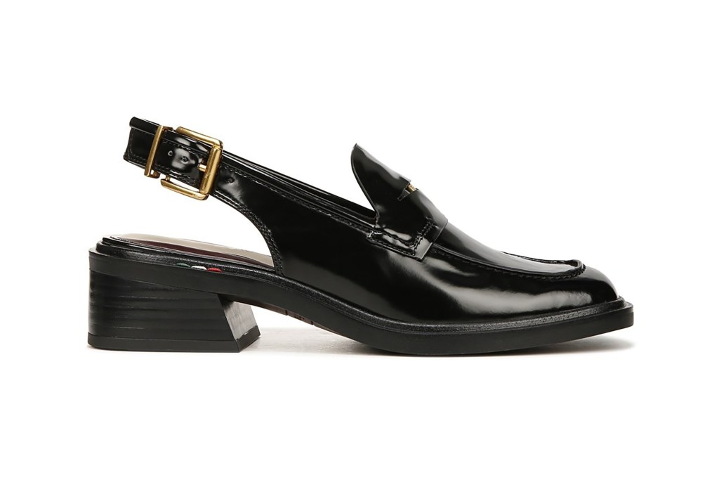 A black leather shoe with a gold buckle