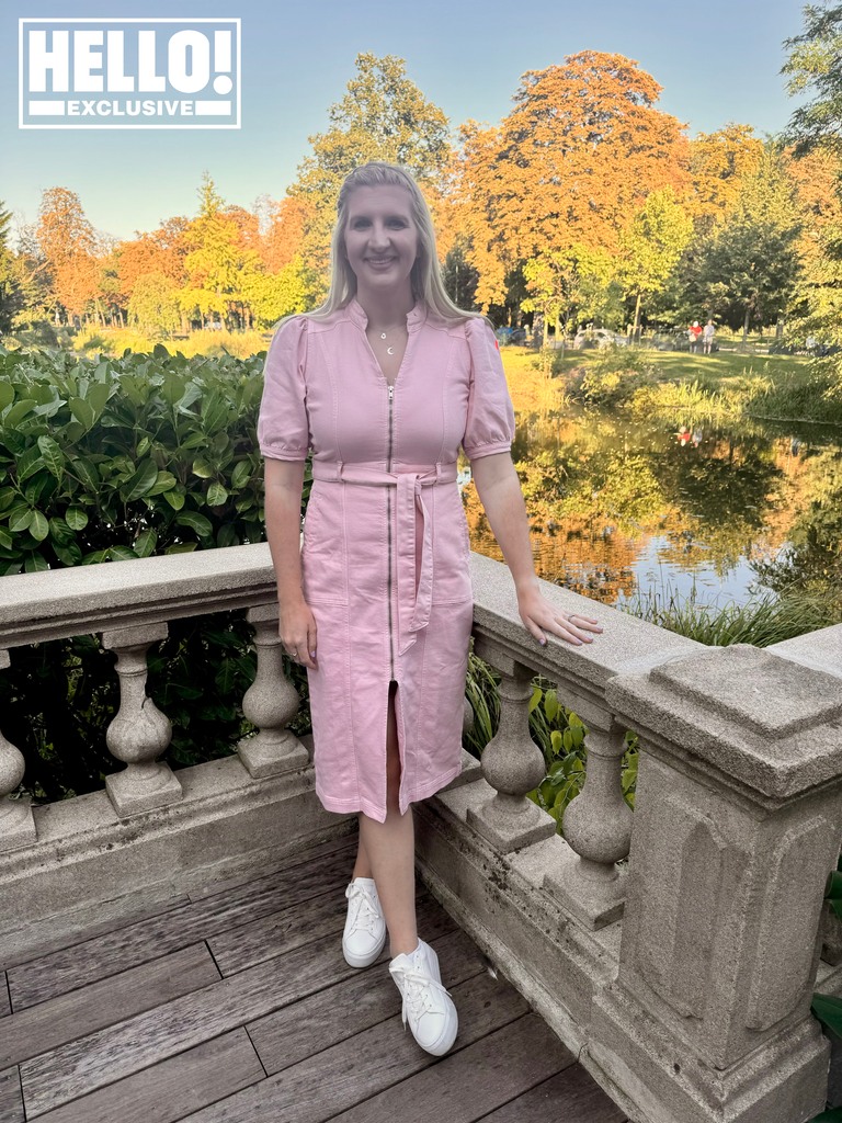 Rebecca Adlington poses in pink dress in gardens