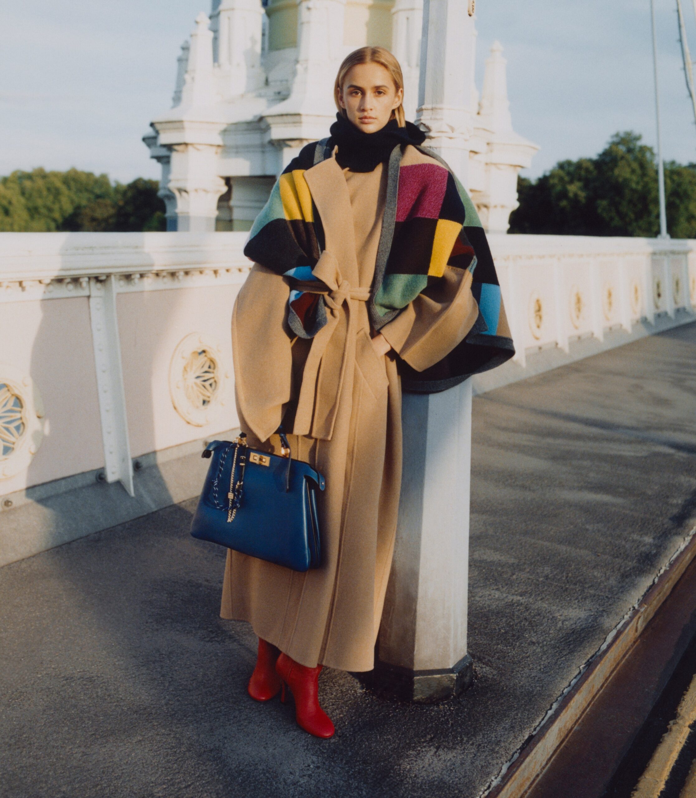 Coat, £3,730, Khaite. Boots, £1,170, Petar Petrov. Knitted hood, £165, and blanket, £1,100, &Daughter. Peekaboo bag, £4,300, Fendi. Bag trick, £450, Miu Miu