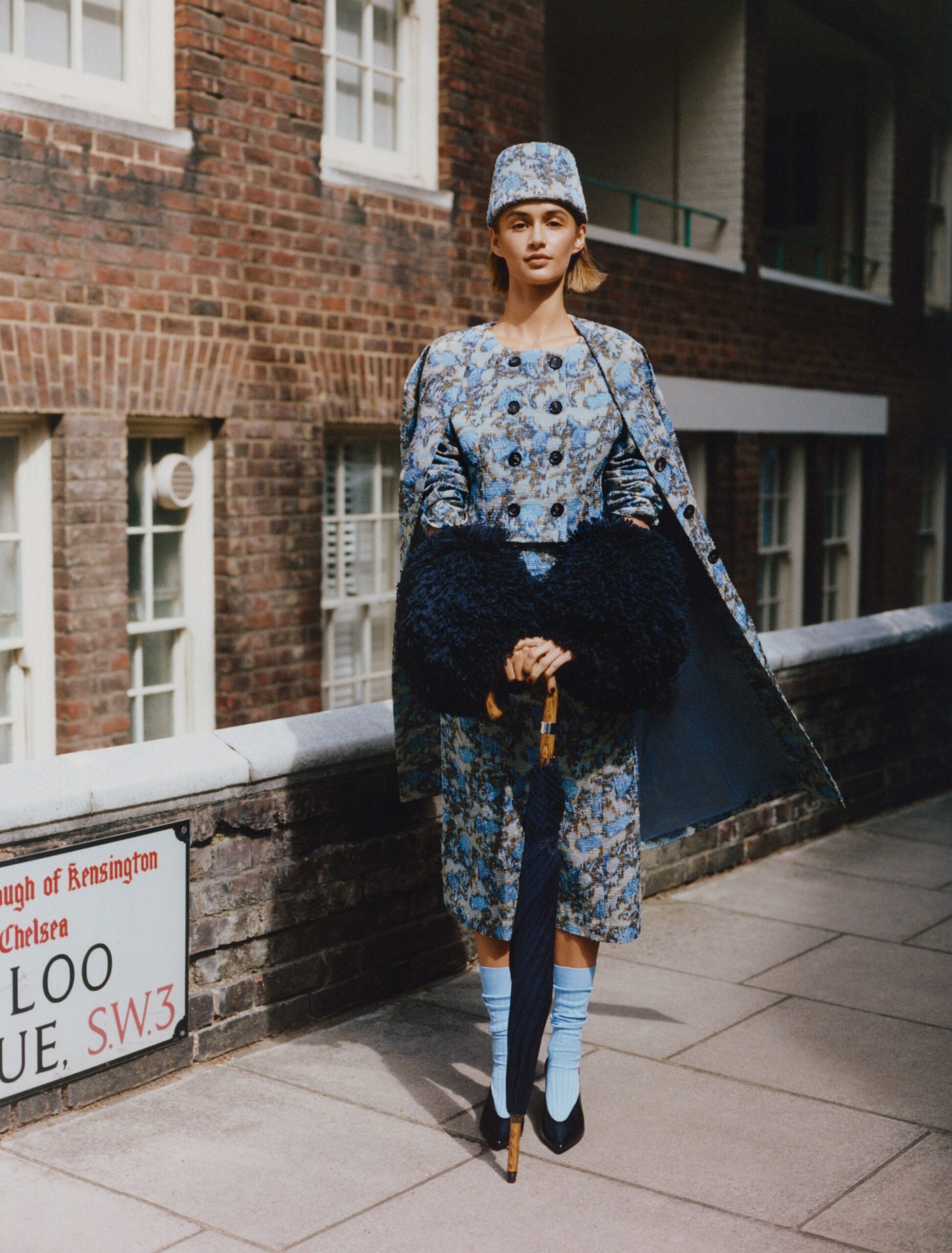 Jacket, £3,585, coat, £4,485, skirt, £2,155, shoes, £990, and hat, £1,255, Loro Piana. Bubble cuffs, £1,370, Alaïa. Umbrella, £340, London Undercover. Socks, £16, Pantherella