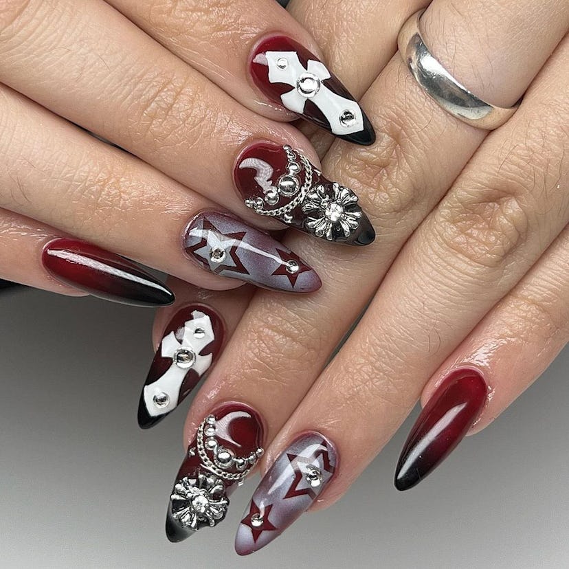 Cherry mocha nails with goth girl-inspired adornments are on-trend for fall 2024.