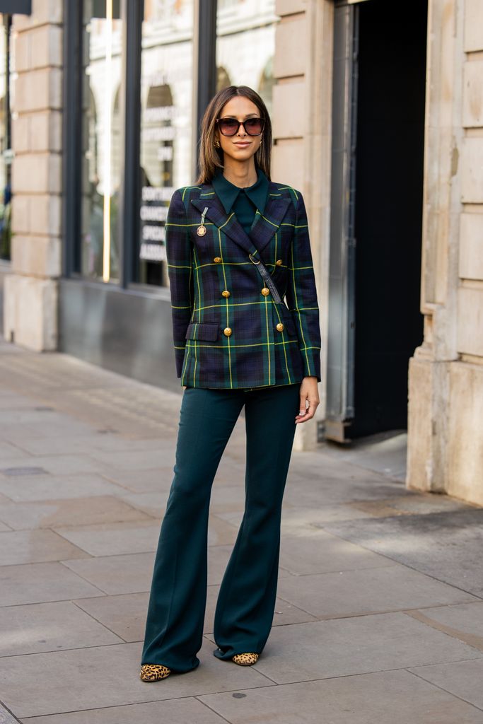 Isabella Charlotta Poppius wears green checkered double breasted blazer, flared pants outside Bora Aksu during London Fashion Week September 2024 on September 13, 2024 in London, England