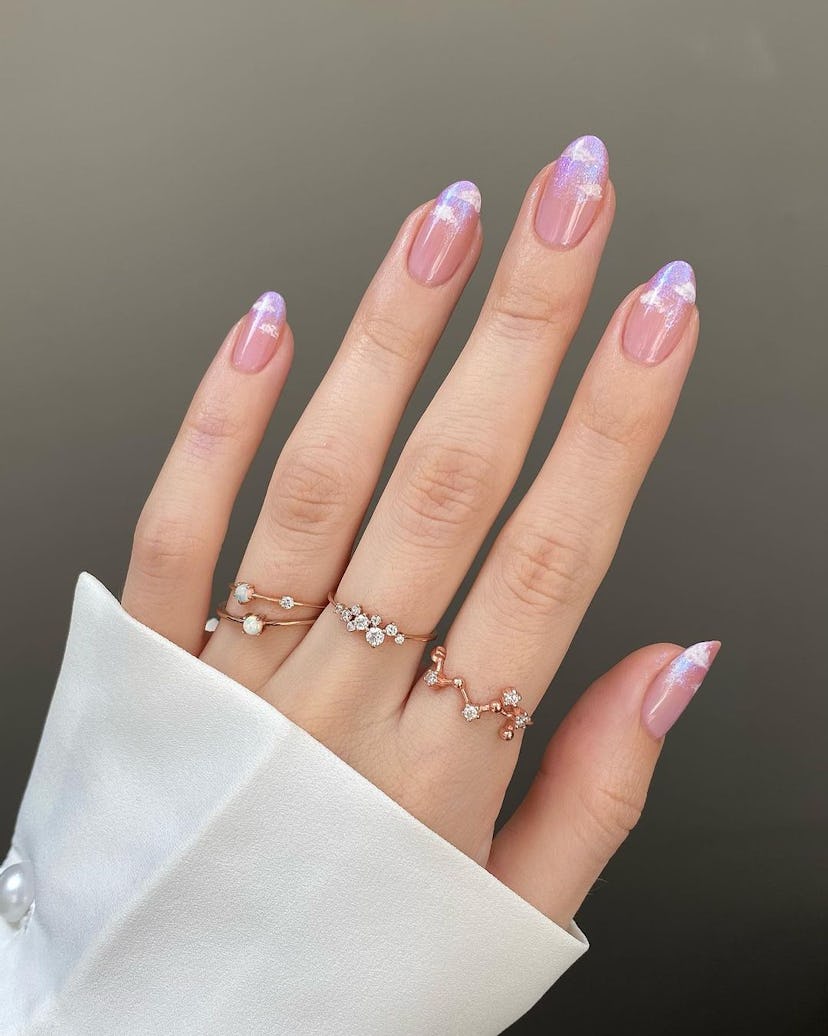 Nails with pastel cloud designs are perfect for Libra season 2024.