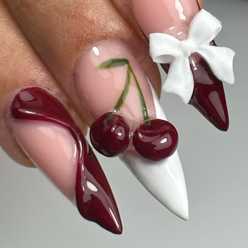 Cherry mocha nails with 3D details are on-trend for fall 2024.