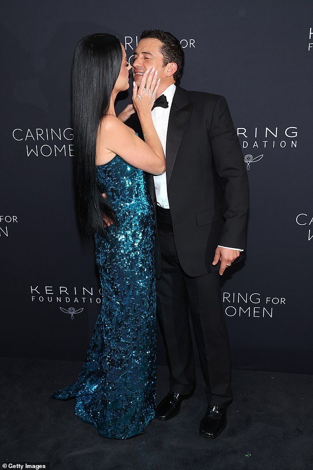 Despite the humorous display, Orlando and Katy looked affectionate as they embraced on the red carpet and shared some romantic kisses