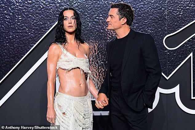 Orlando - who shares daughter Daisy with Katy - gazed adoringly at her as they held hands on the red carpet