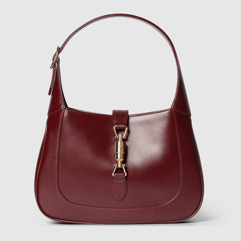 red shoulder bag with gold hardware