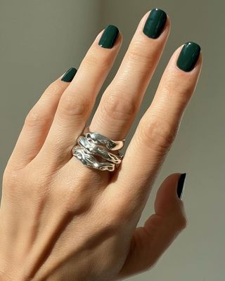 A deep, emerald green manicure by Betina Goldstein