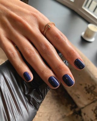 A deep blue manicure by Georgia Rae