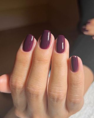 An eggplant purple manicure by Georgia Rae