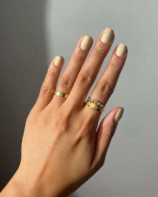 A shimmering, gold manicure by Iram Shelton