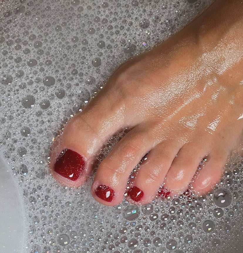 Sparkling blood red pedicures are perfect for Scorpio season 2024.