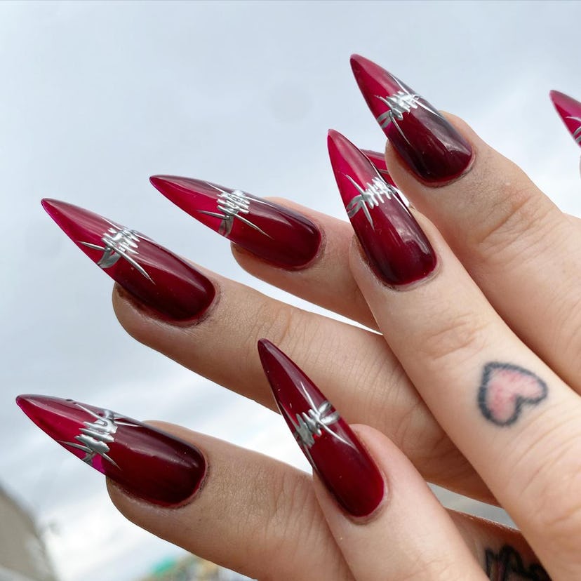 Blood red nails with barbed wire details are perfect for Scorpio season 2024.