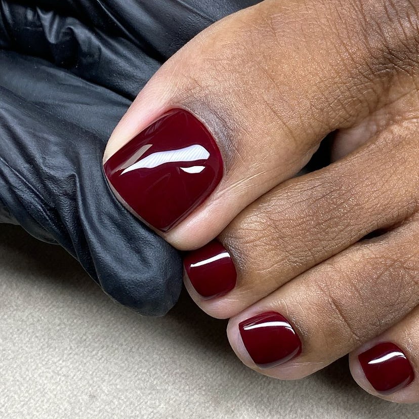 Dark burgundy pedicures are perfect for Scorpio season 2024.