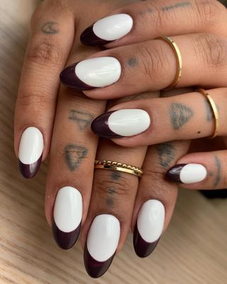 White and burgundy nails.