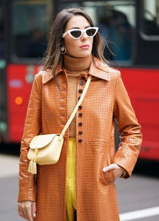 Woman wearing statement sunglasses in London