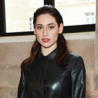 A guest wearing half-slicked hair, a Paris Fashion Week SS25 Beauty Street Style look