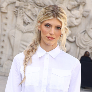 A guest wearing messy plaits, a Paris Fashion Week SS25 Beauty Street Style look