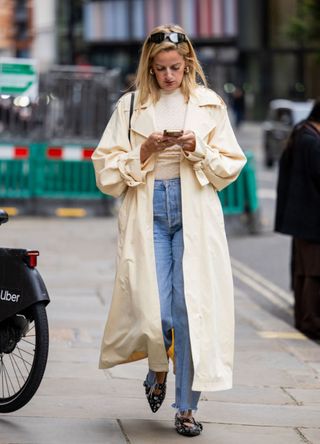 Woman with a long cream coat