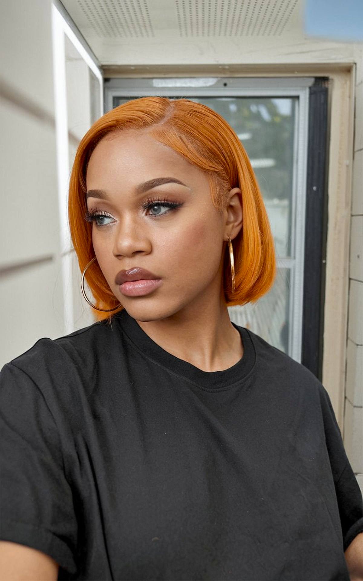 Silk press short bob with ginger color and sleek finish